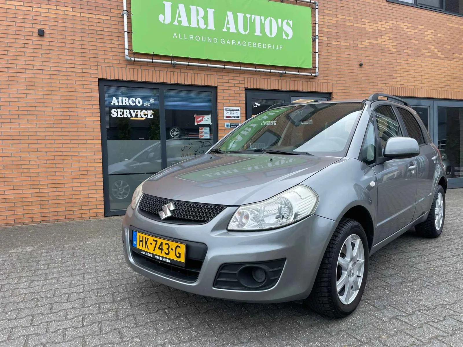 Suzuki SX4 (2010) — foto 1