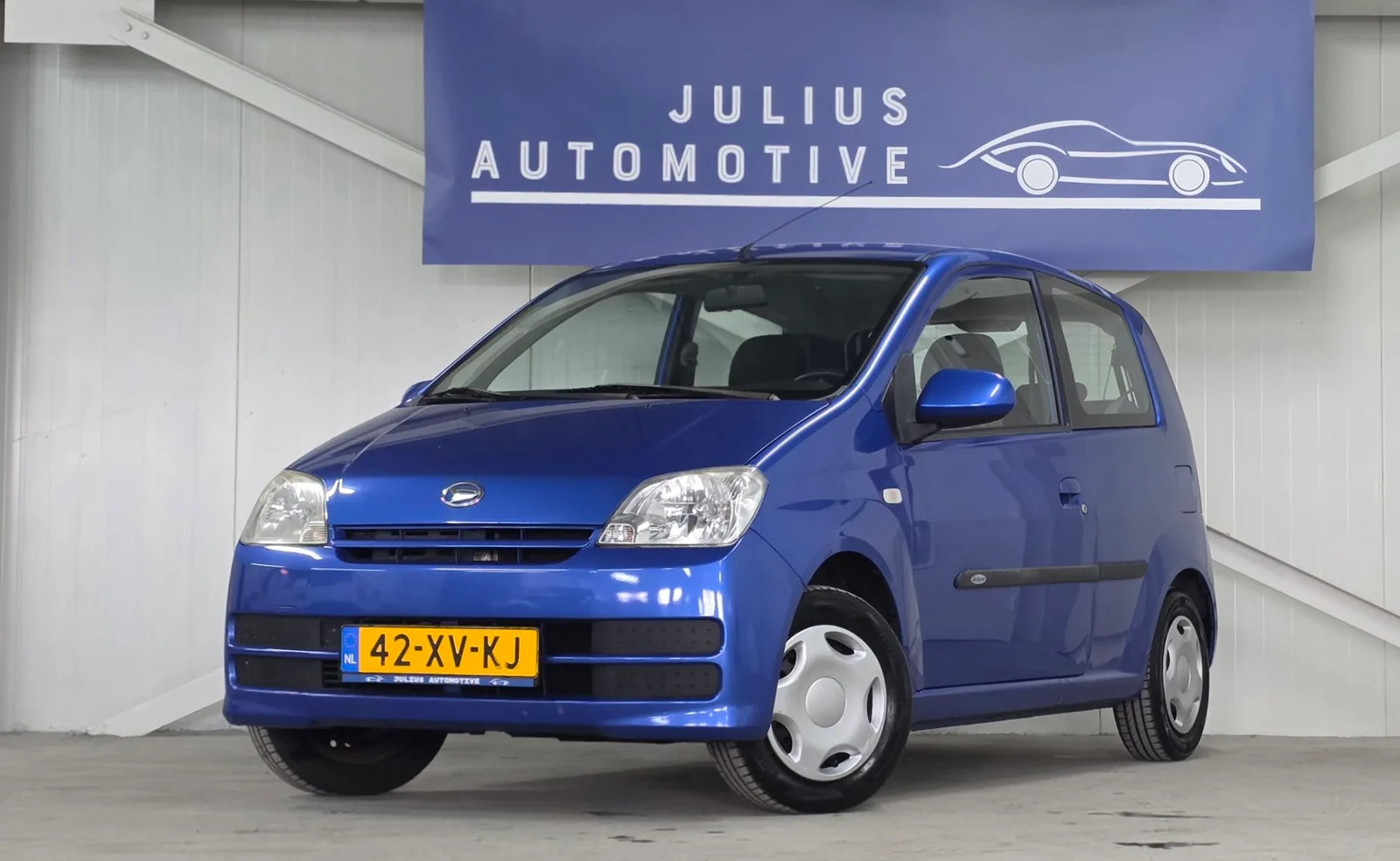 Daihatsu Cuore (2007) — foto 1