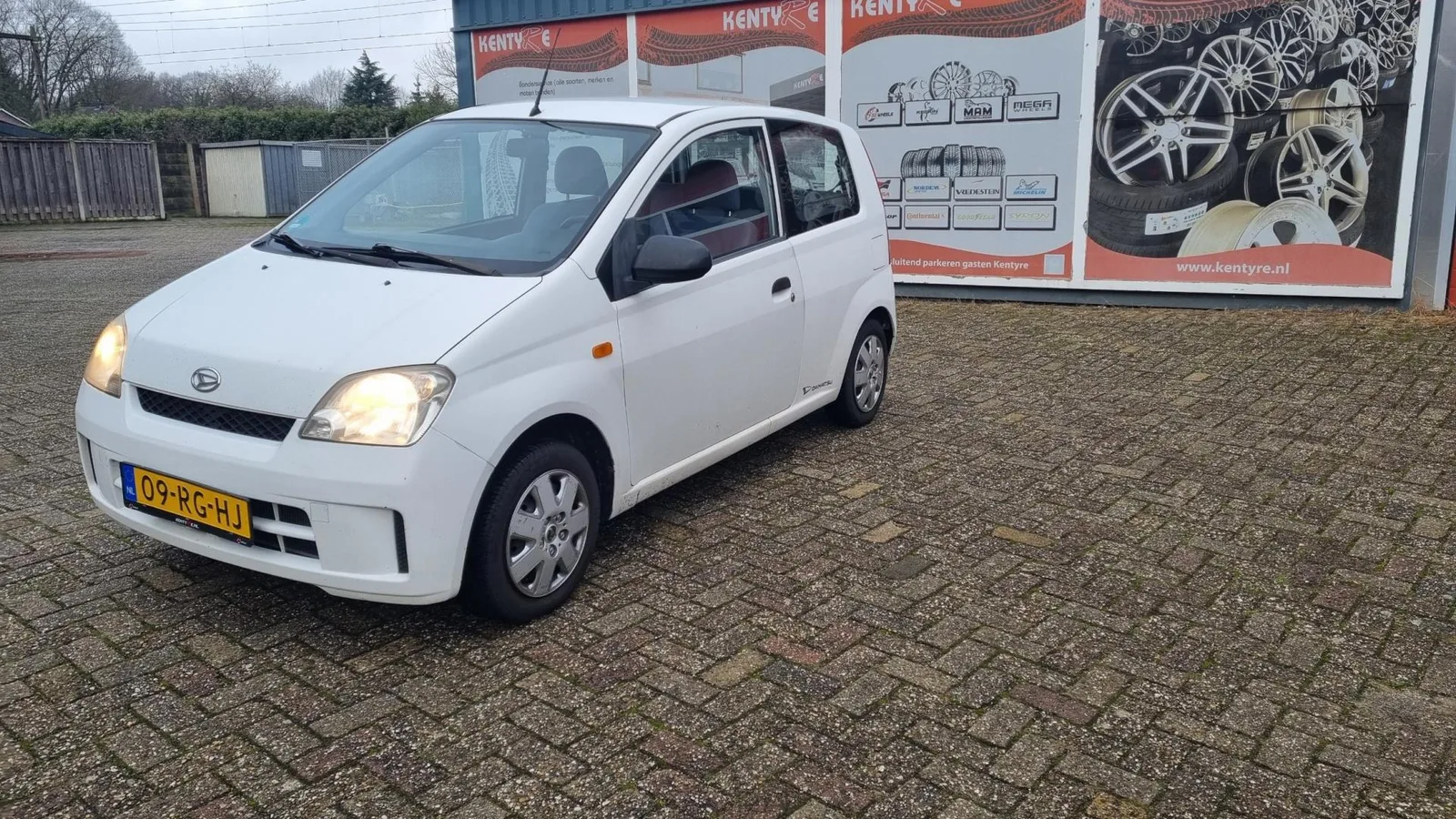 Daihatsu Cuore (2005) — foto 1