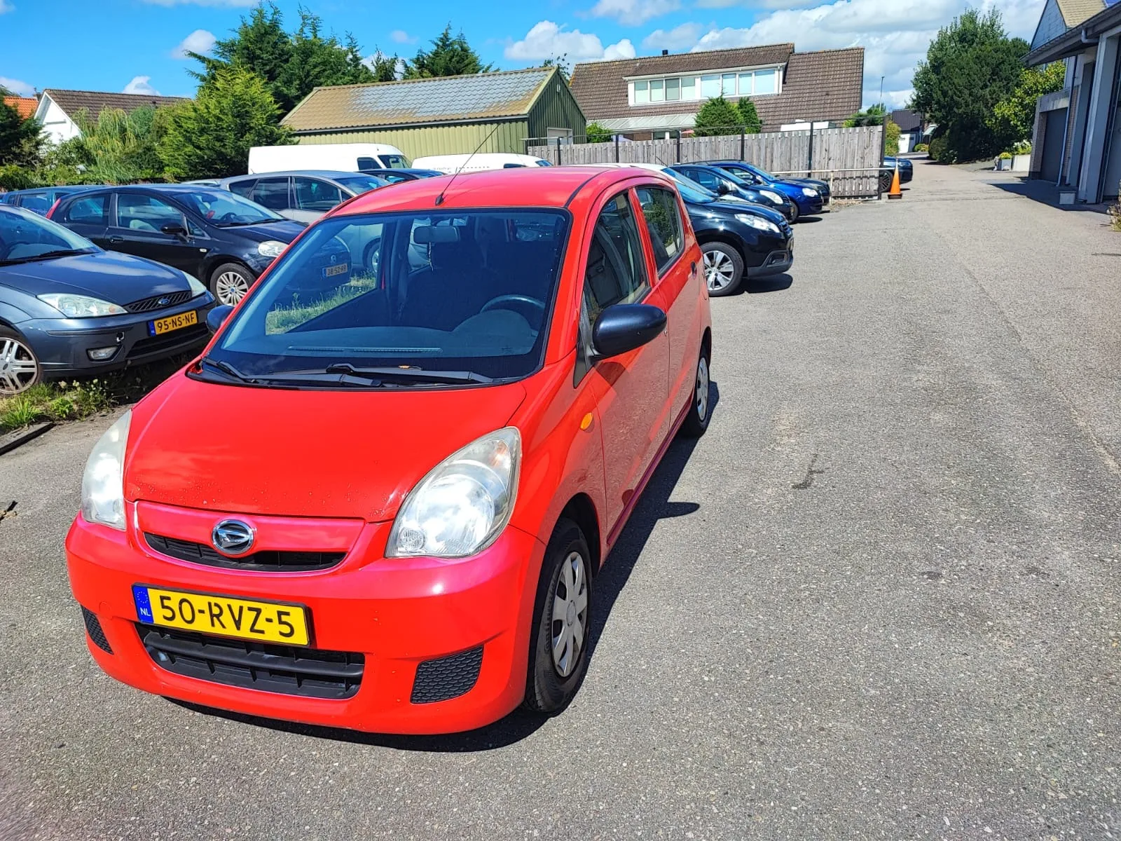 Daihatsu Cuore (2011) — foto 1