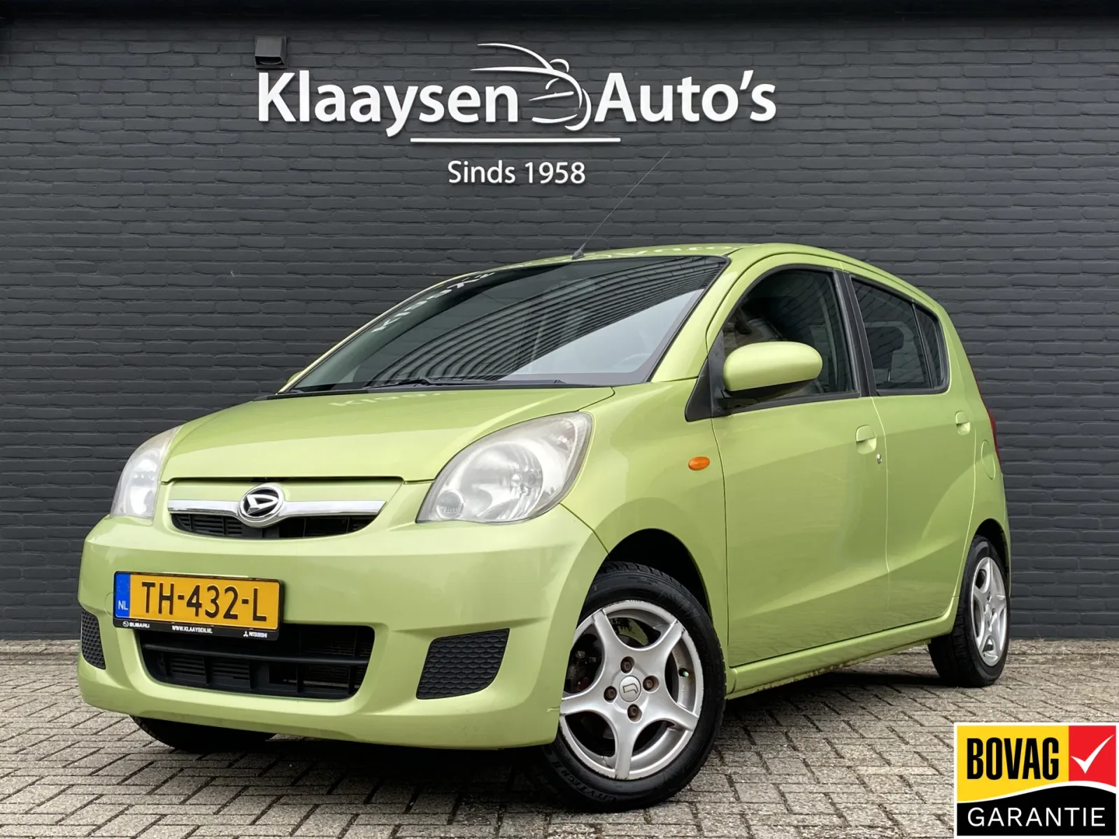 Daihatsu Cuore (2007) — foto 1