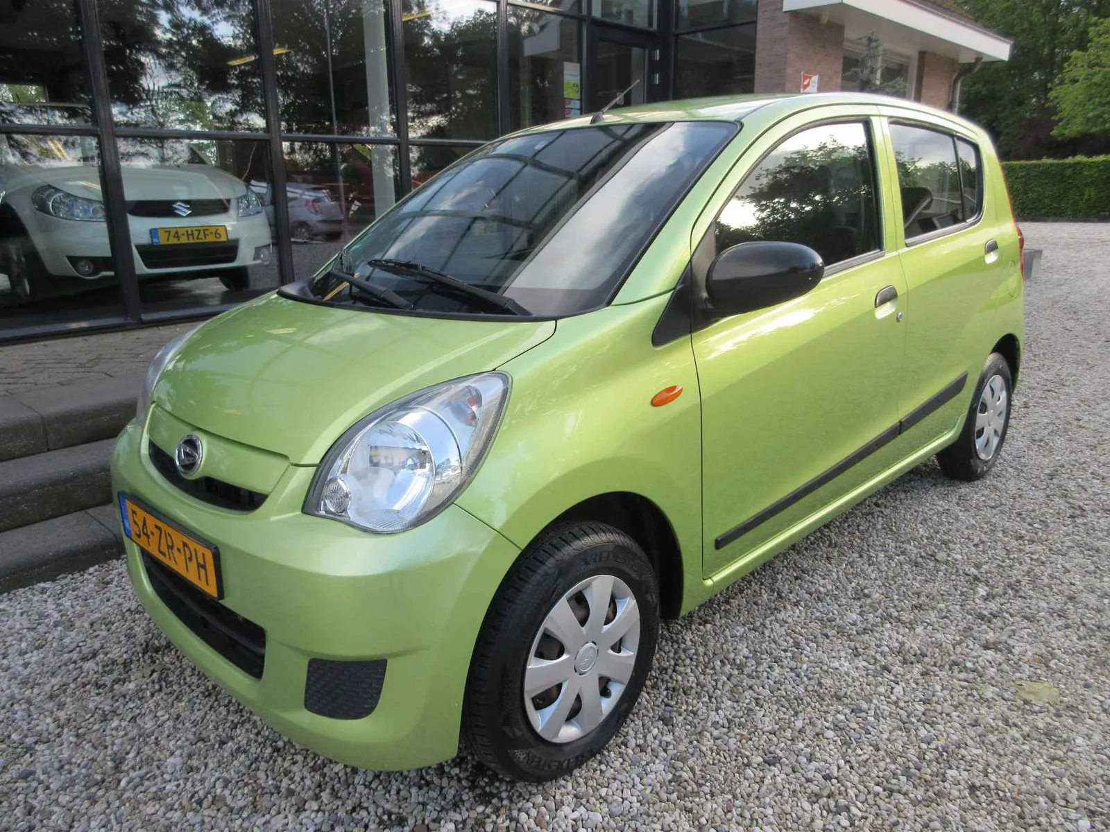 Daihatsu Cuore (2008) — foto 1
