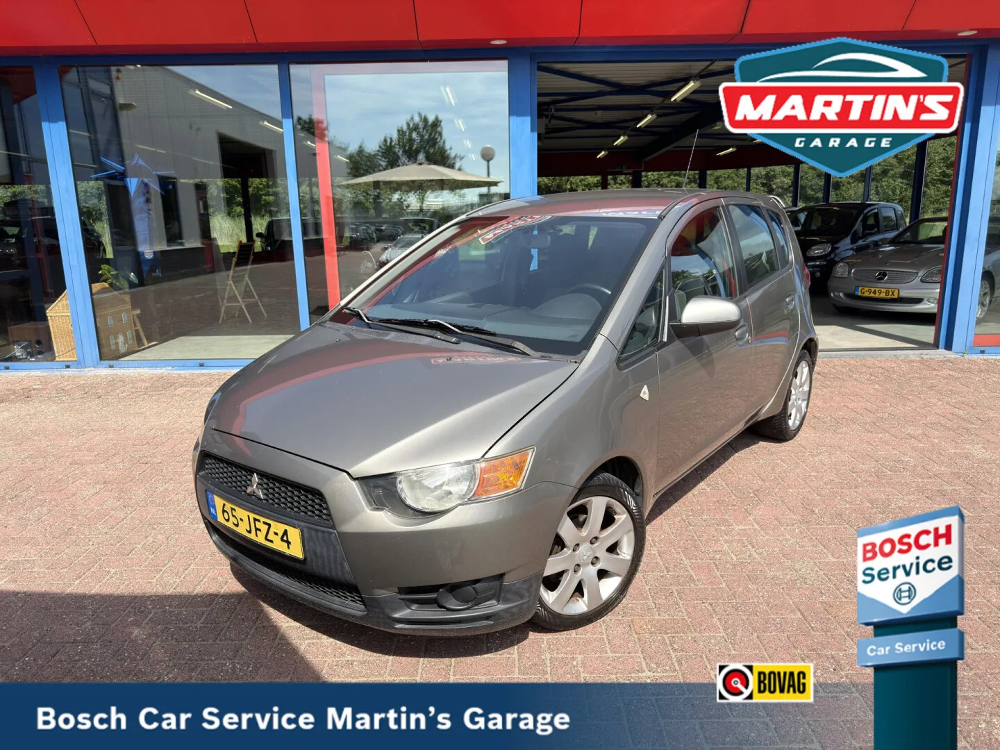 Mitsubishi Colt (2009) — foto 1