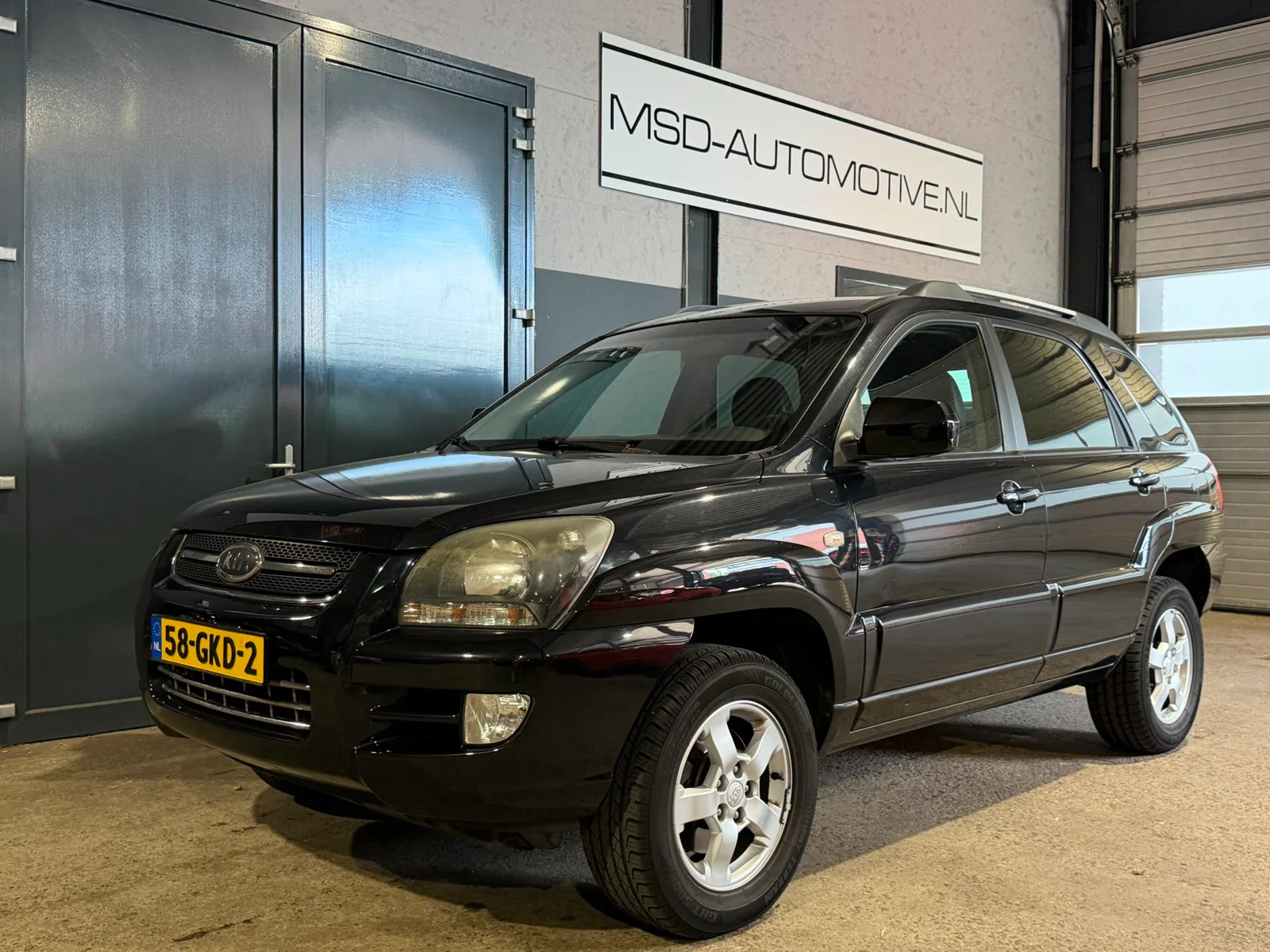 Kia Sportage (2008) — foto 1
