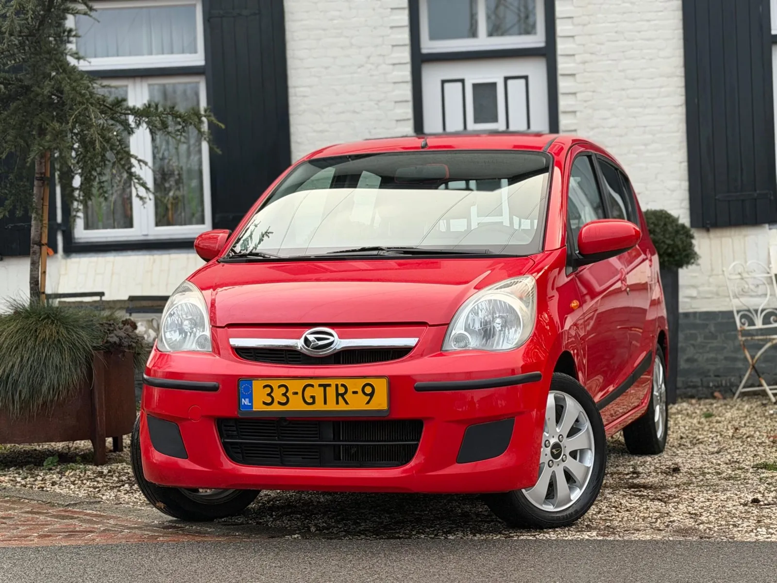 Daihatsu Cuore (2008) — foto 1