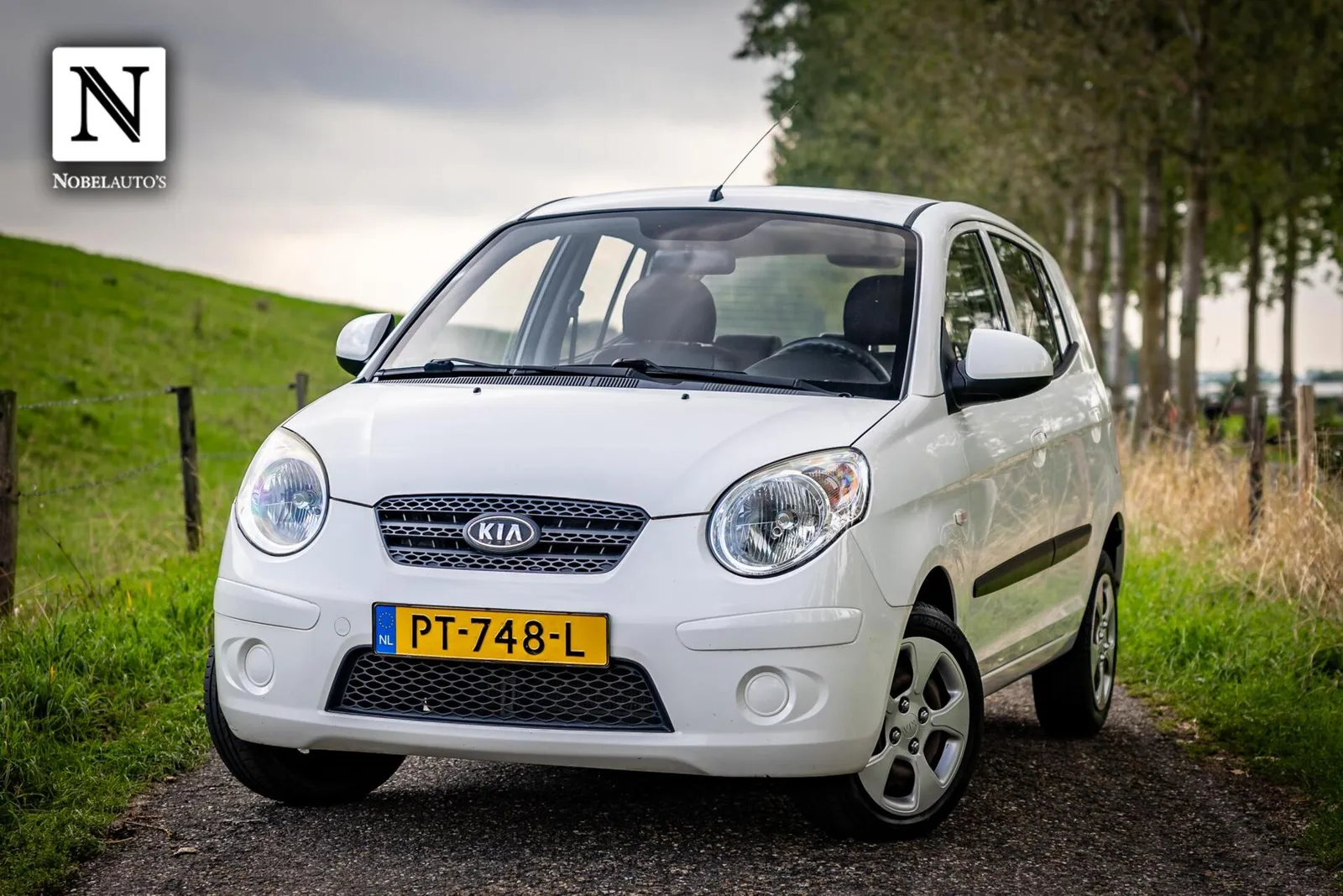 Kia Picanto (2009) — foto 1