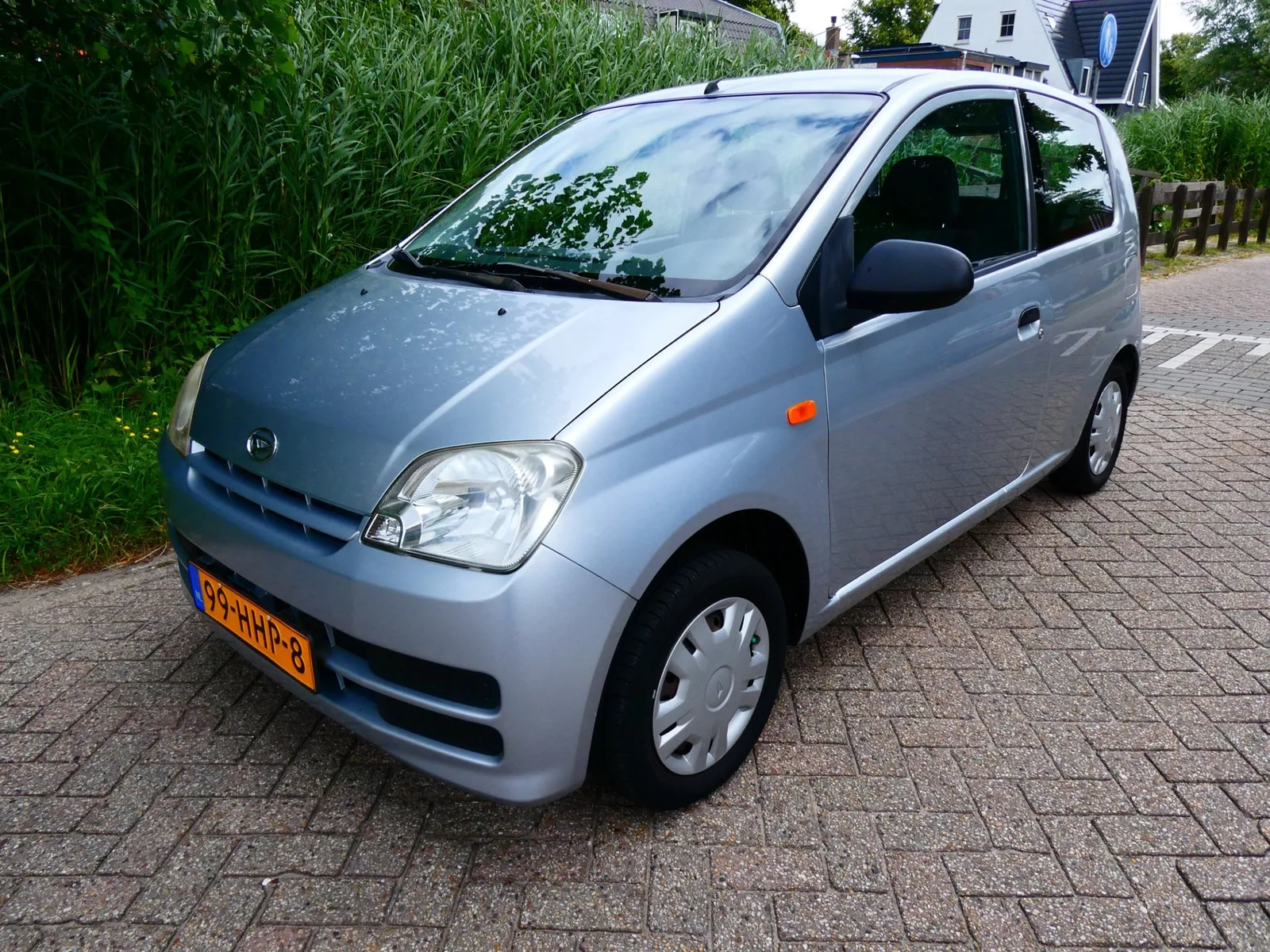 Daihatsu Cuore (2008) — foto 1