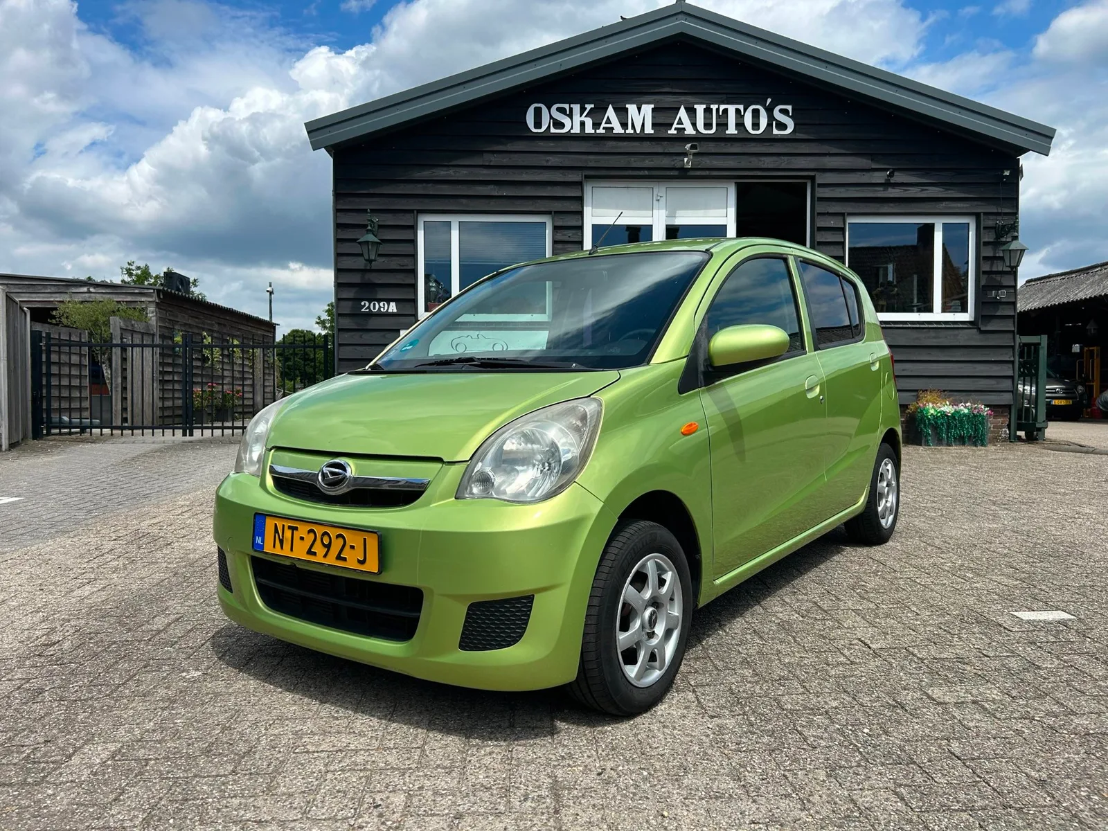 Daihatsu Cuore (2008) — foto 1