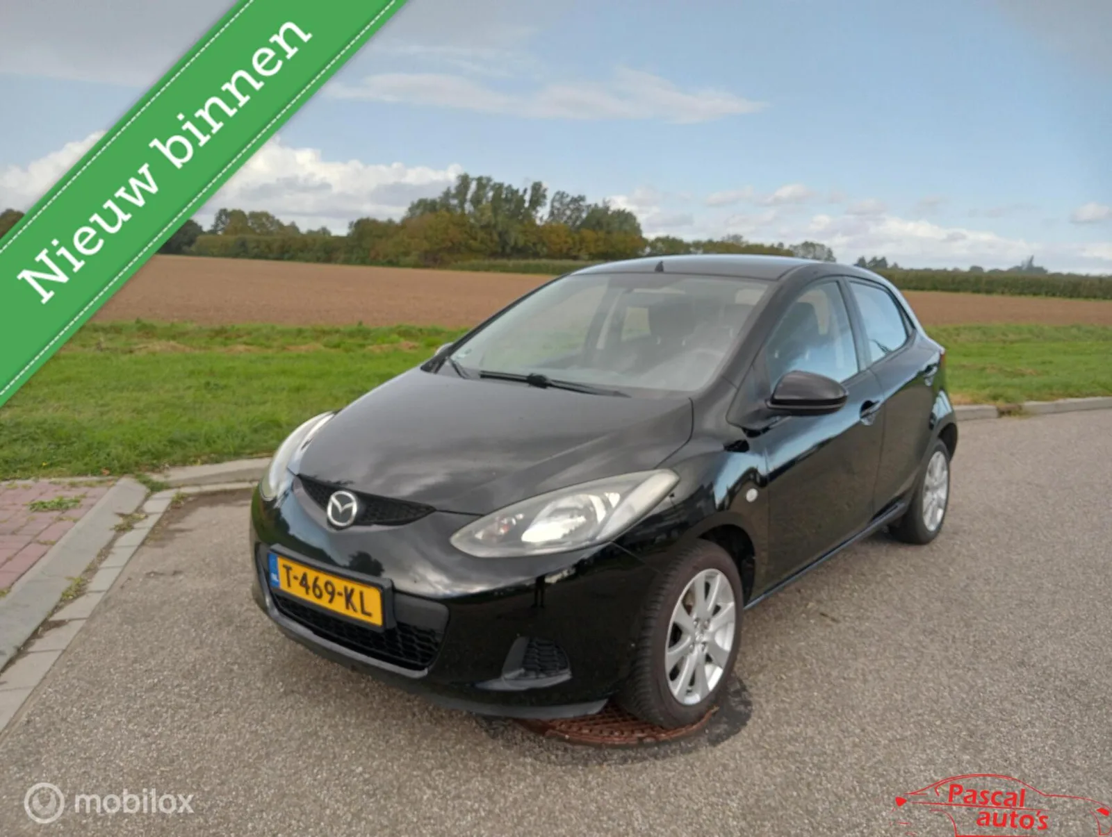 Mazda 2 (2009) — foto 1