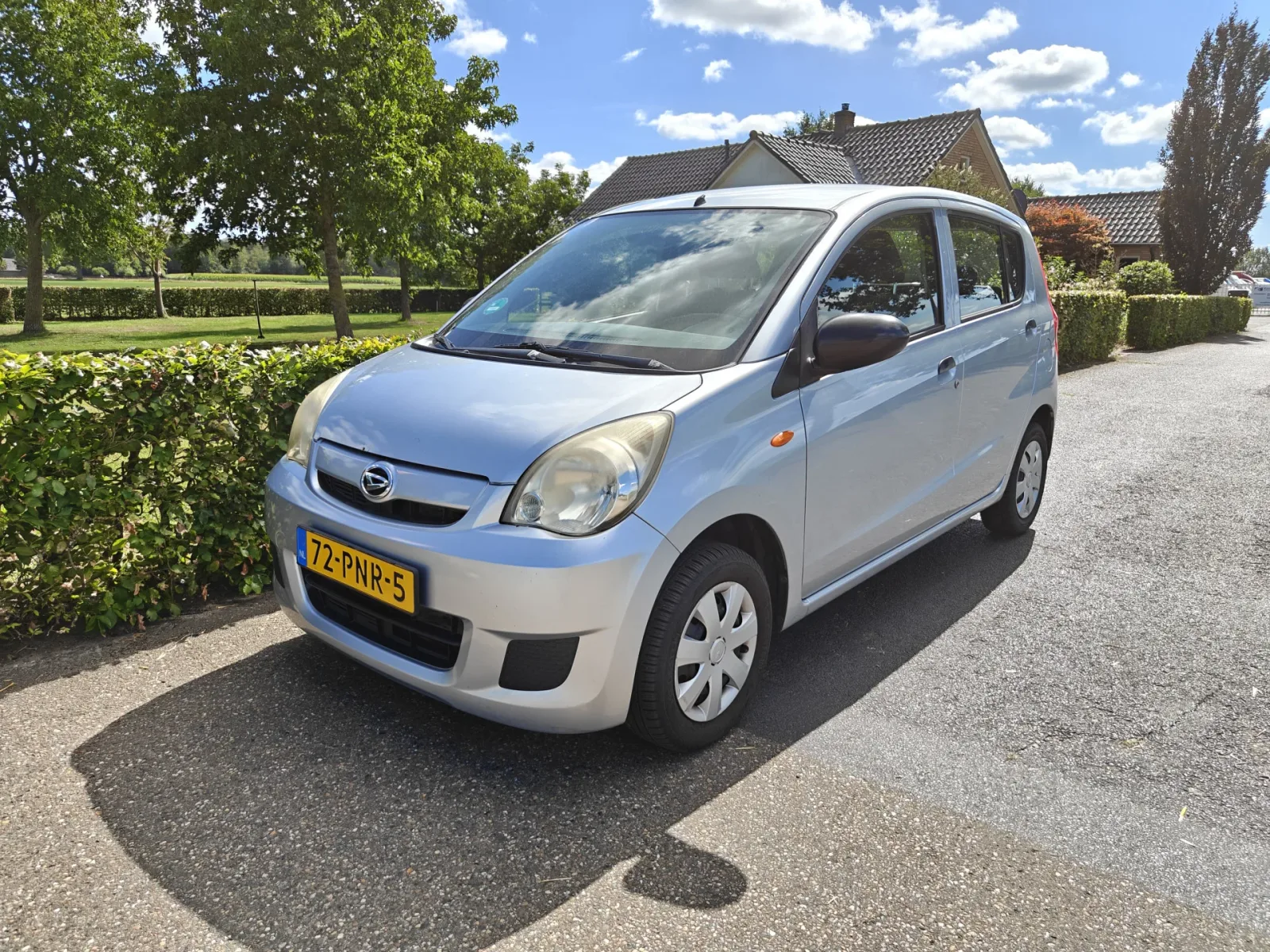 Daihatsu Cuore (2011) — foto 1