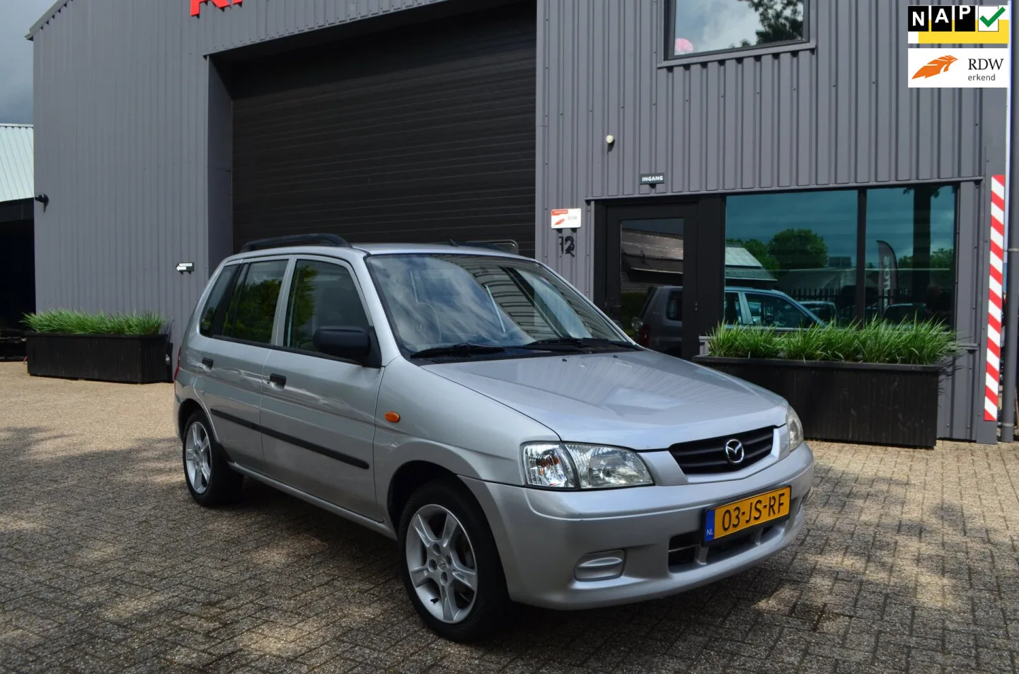 Mazda Demio (2002) — foto 1