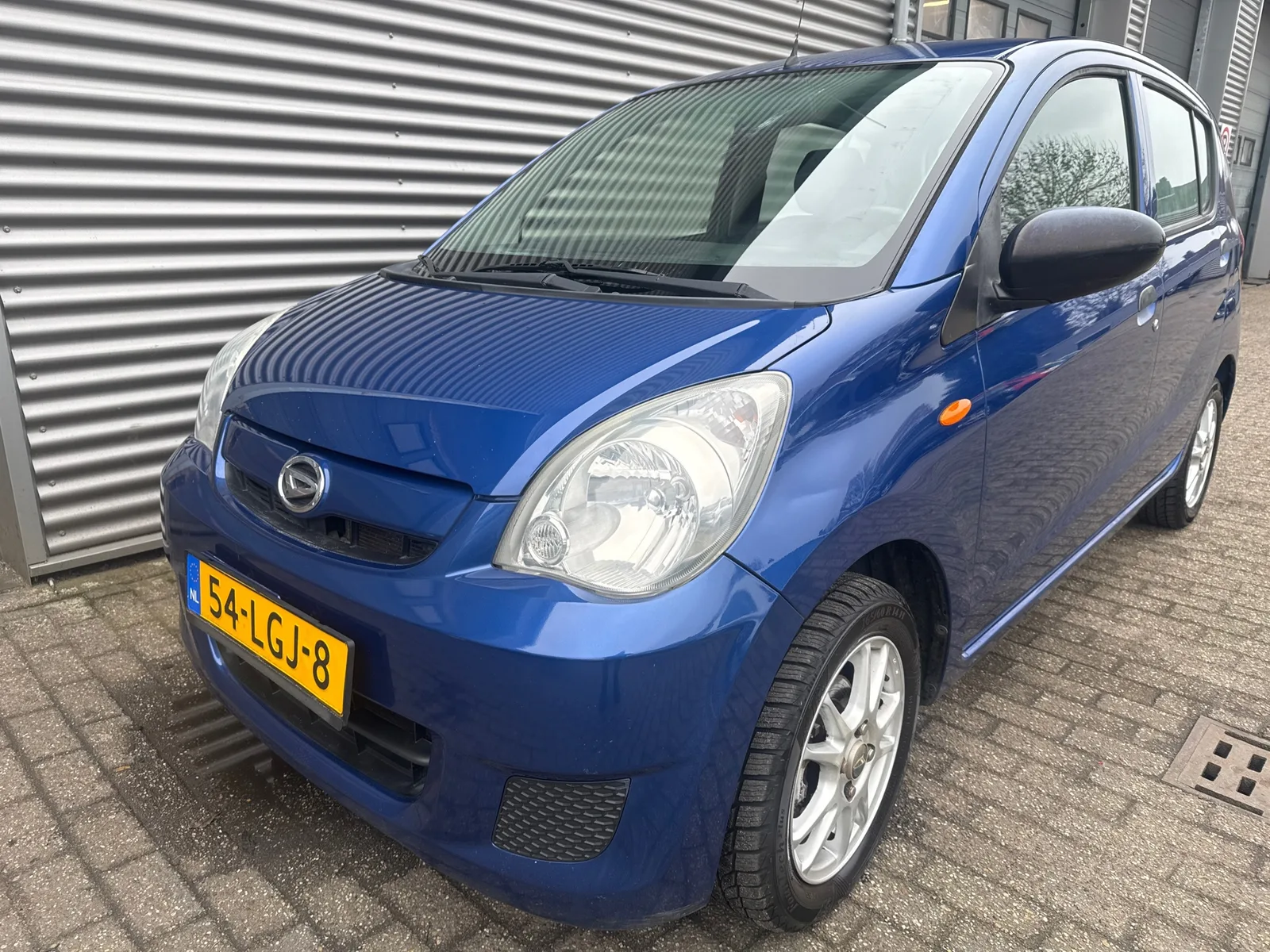 Daihatsu Cuore (2010) — foto 1