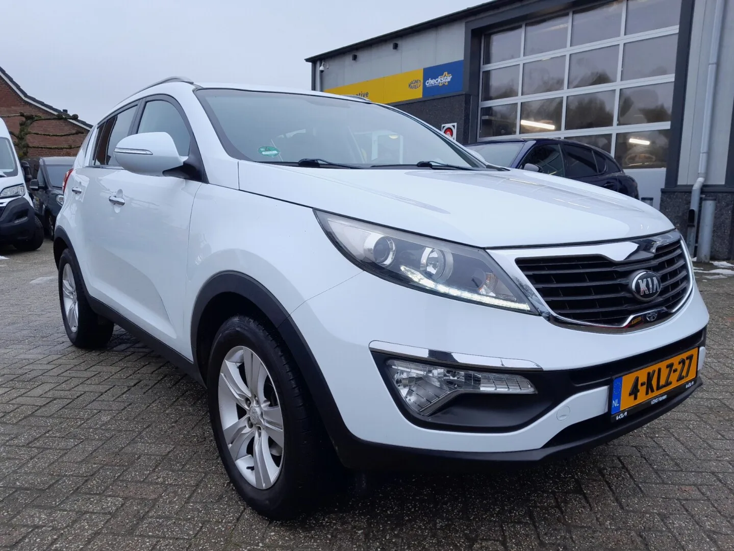 Kia Sportage (2013) — foto 1