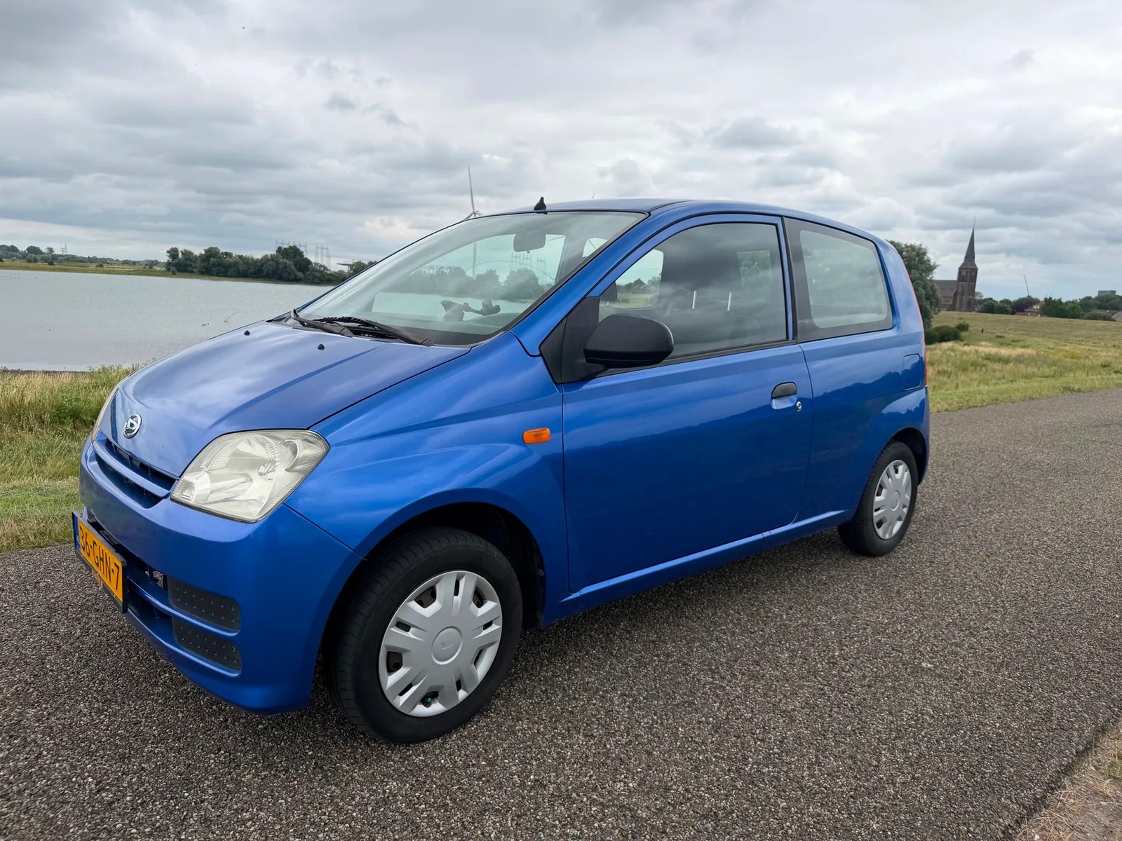 Daihatsu Cuore (2008) — foto 1