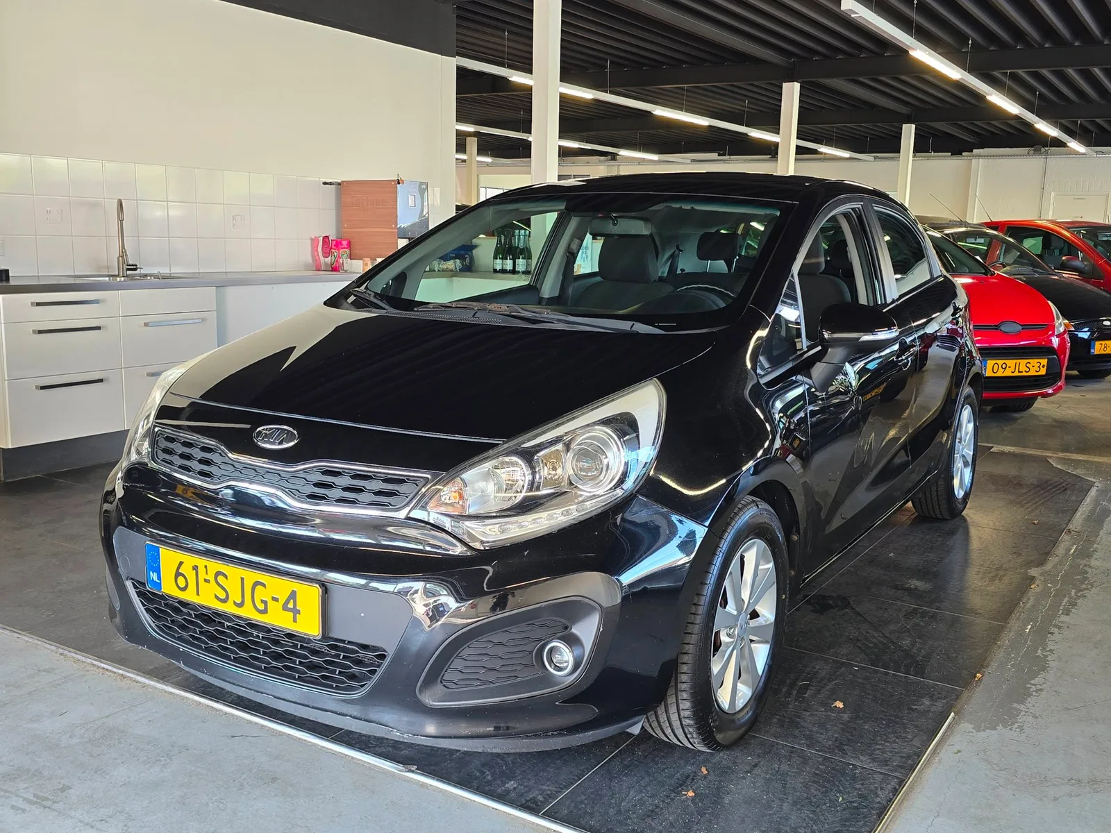 Kia Rio (2011) — foto 1
