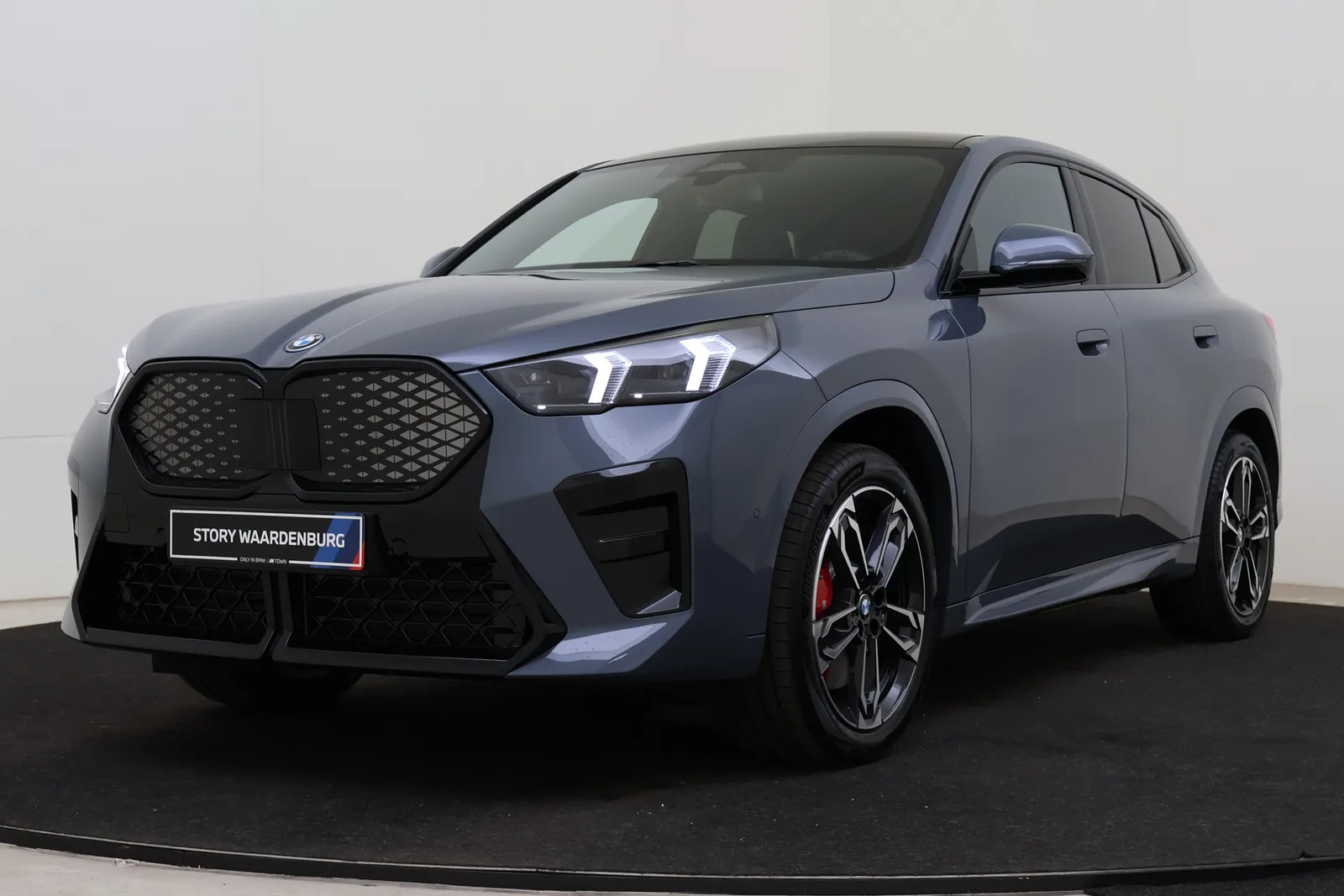 BMW iX2 (2026) — foto 1