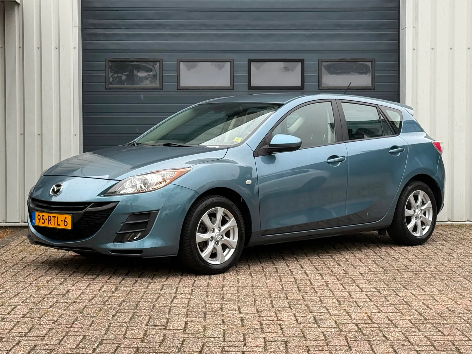 Mazda 3 (2011) — foto 1