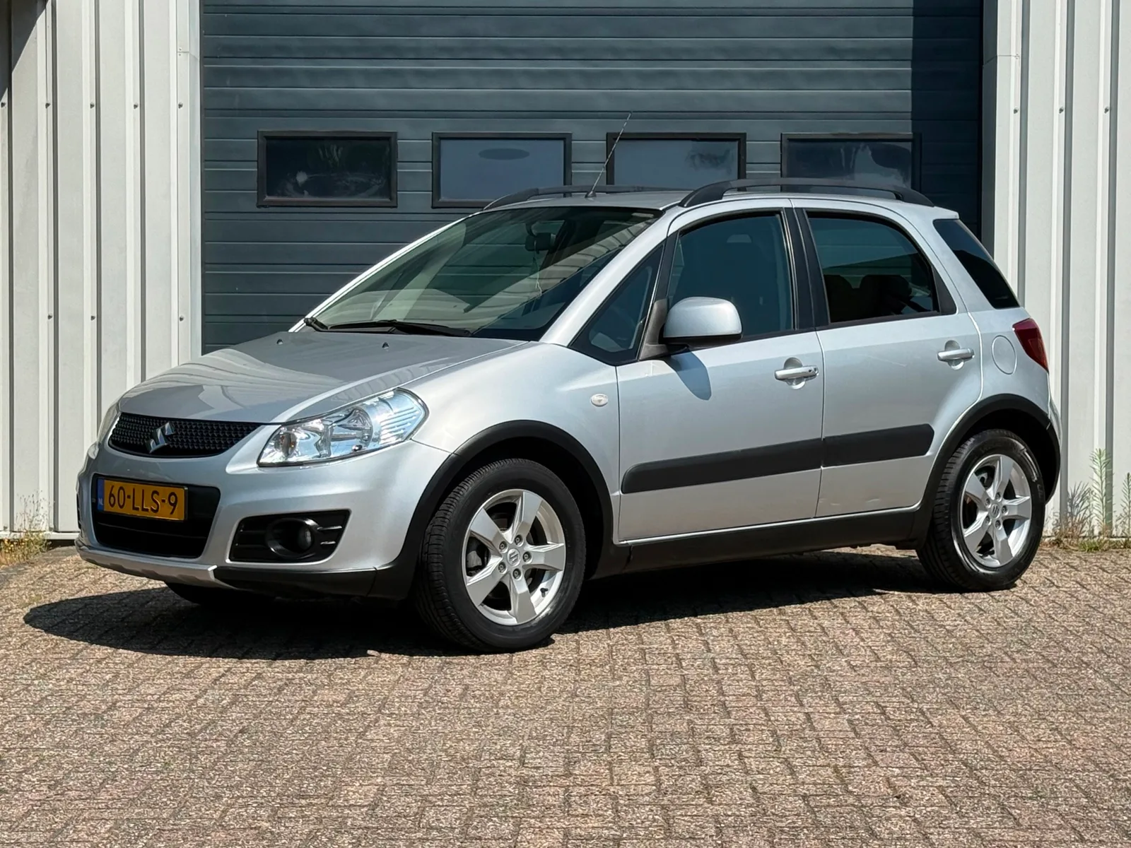 Suzuki SX4 (2010) — foto 1