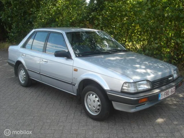 Mazda 323 (1988) — foto 1