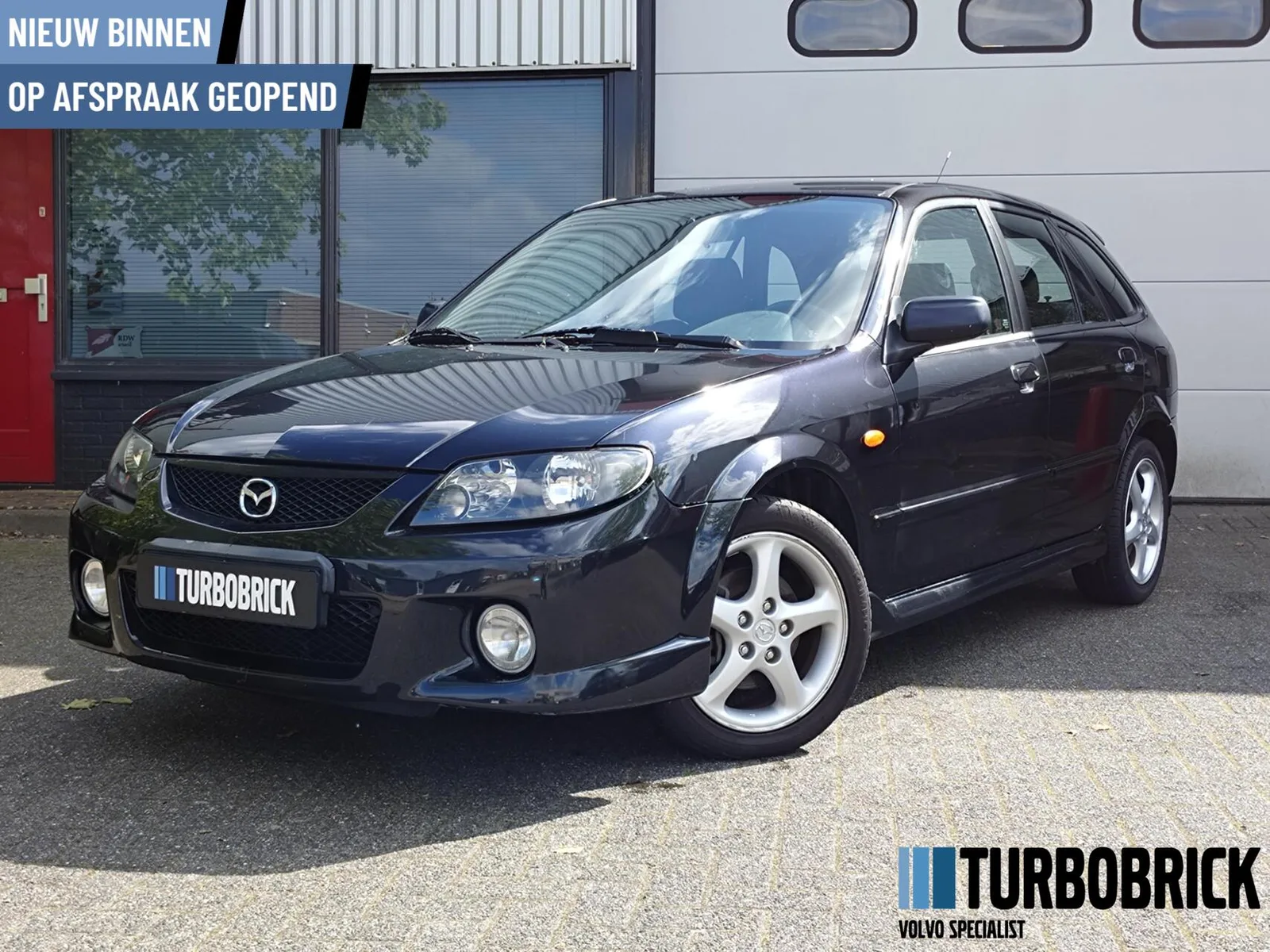 Mazda 323 (2003) — foto 1