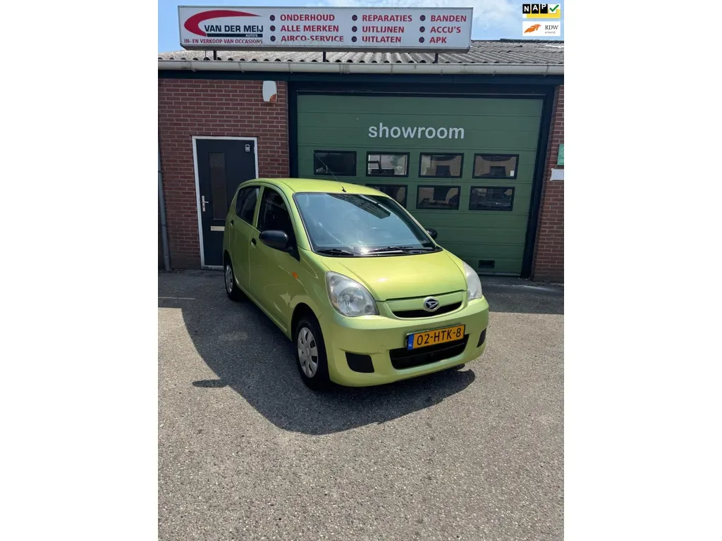 Daihatsu Cuore (2009) — foto 1