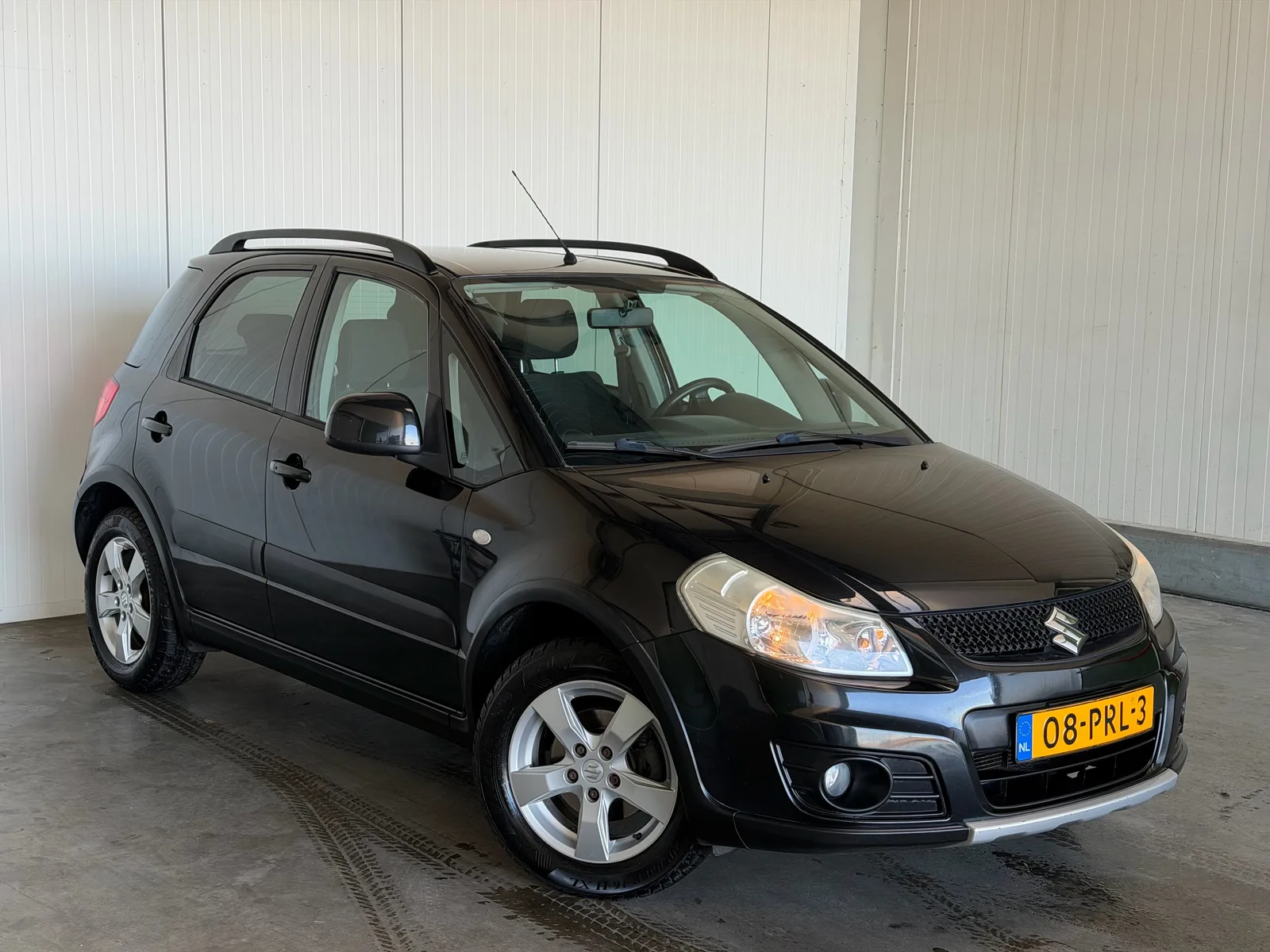 Suzuki SX4 (2011) — foto 1