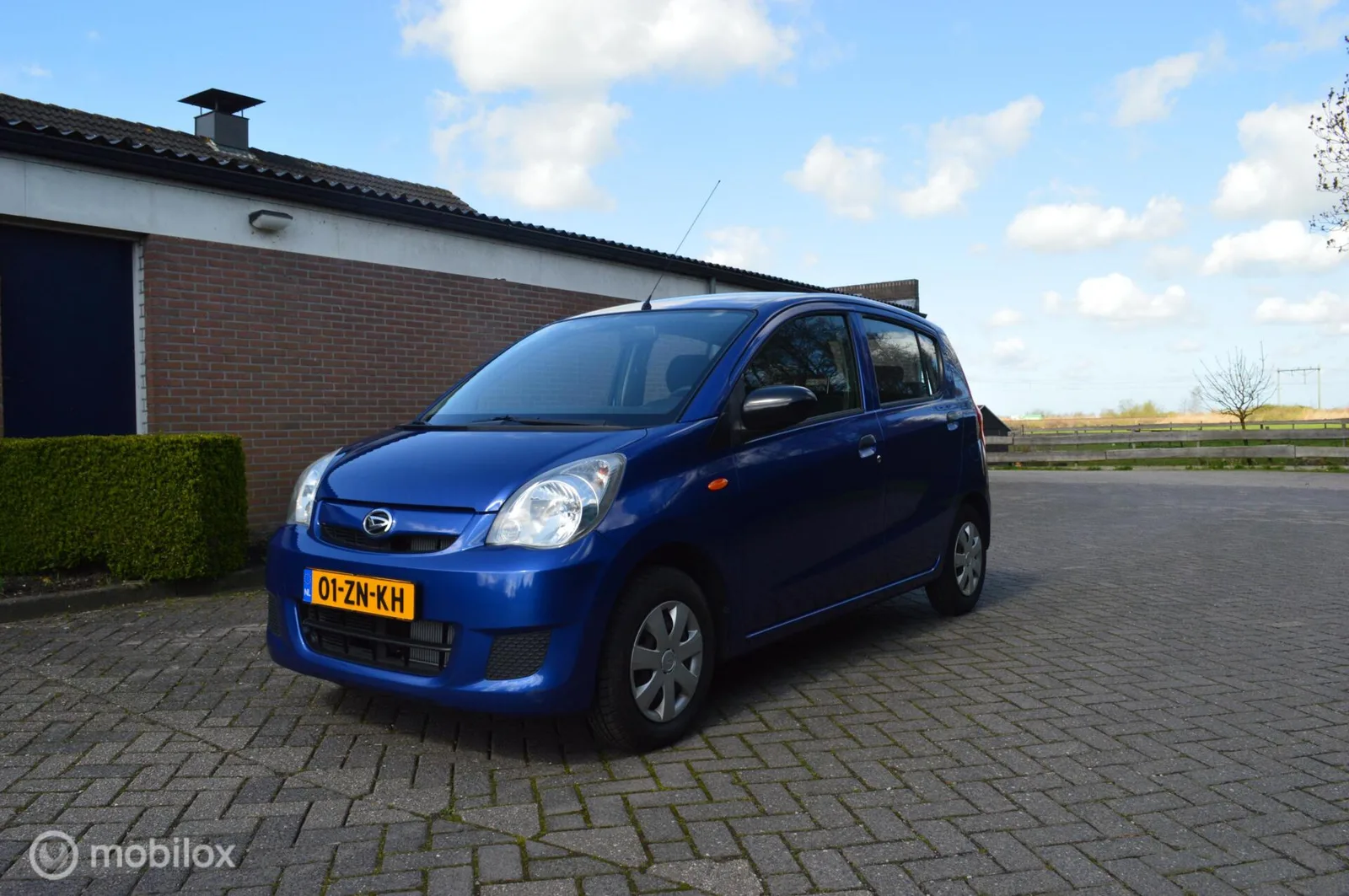 Daihatsu Cuore (2008) — foto 1
