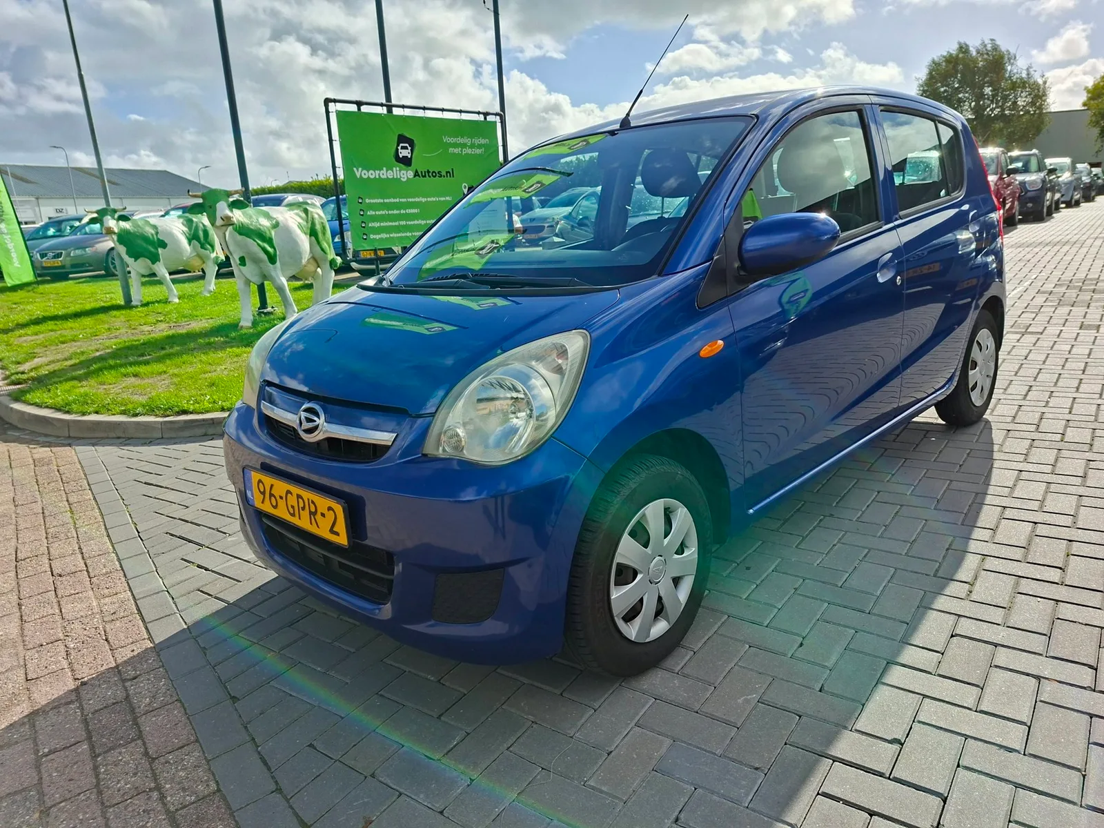 Daihatsu Cuore (2008) — foto 1