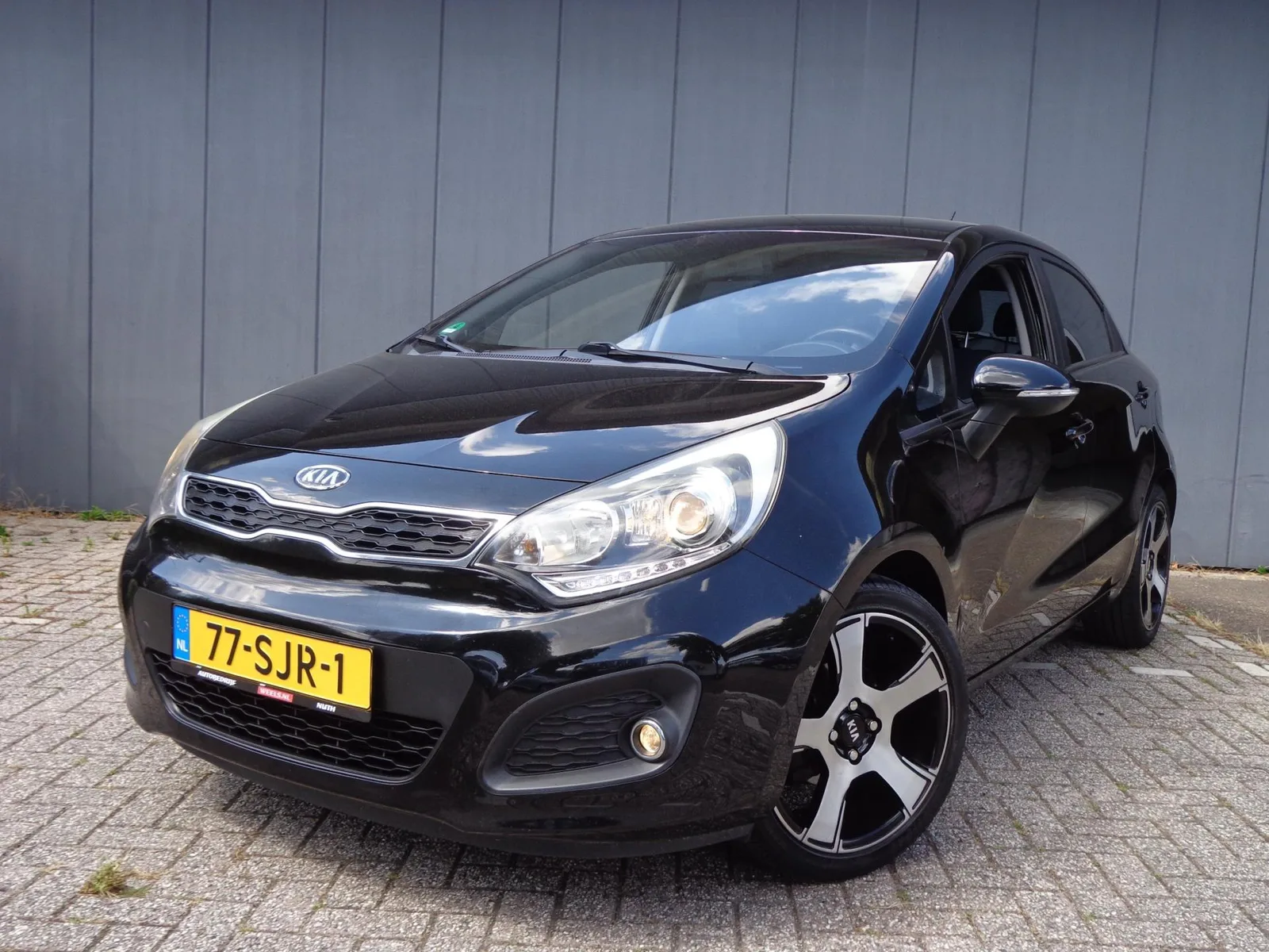 Kia Rio (2011) — foto 1