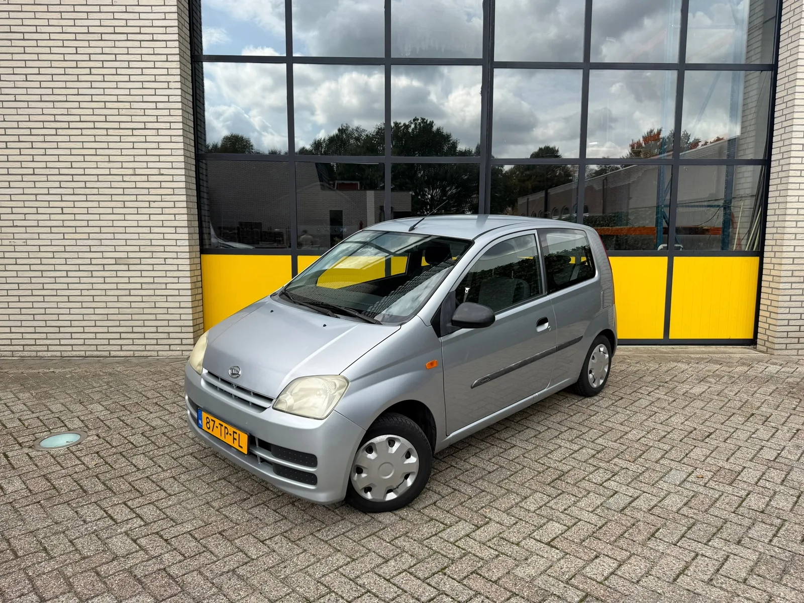 Daihatsu Cuore (2006) — foto 1