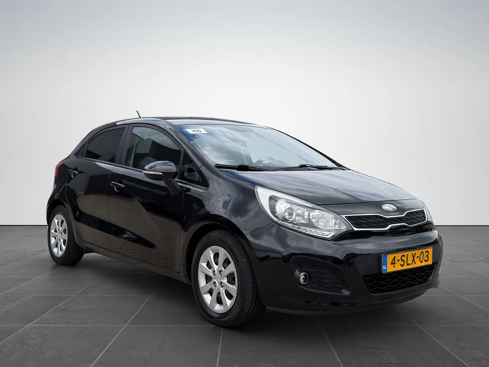Kia Rio (2013) — foto 1