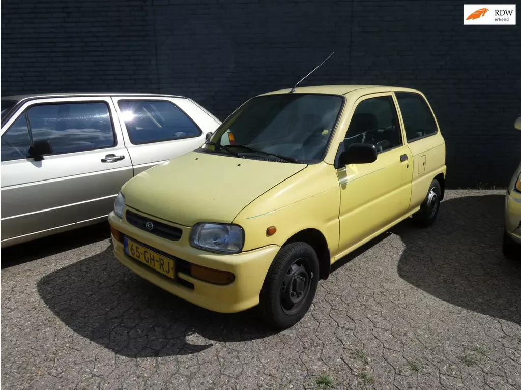 Daihatsu Cuore (1997) — foto 1