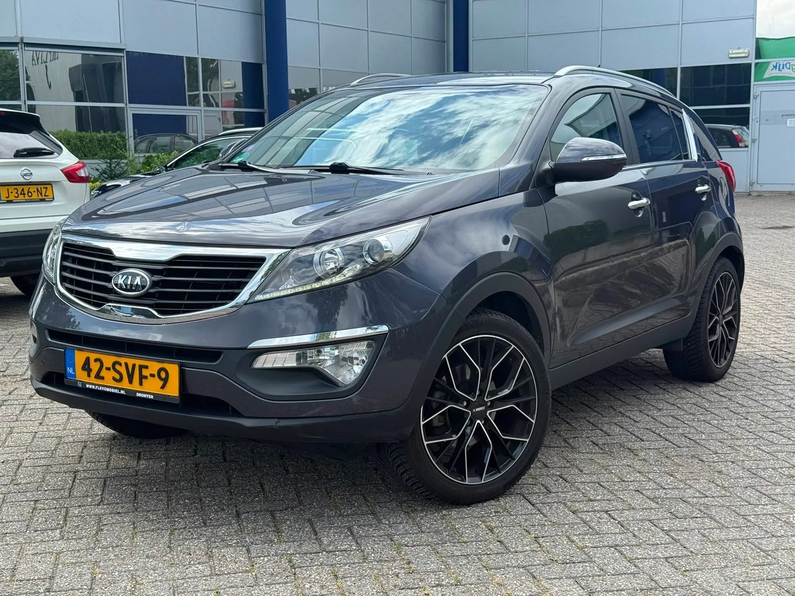 Kia Sportage (2012) — foto 1